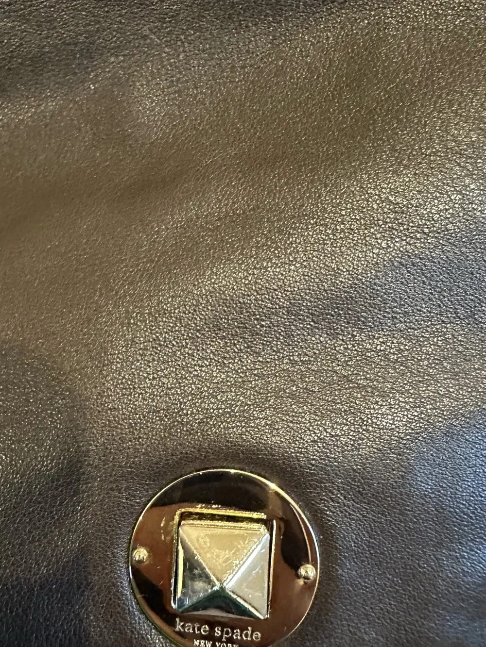 kate spade black leather tote with star emblem hardware
